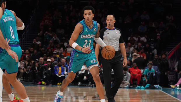 Feb 10, 2024; Charlotte, North Carolina, USA; Charlotte Hornets guard Tre Mann (23) handles the ball against the Memphis Grizzlies during the first quarter at Spectrum Center. Mandatory Credit: Jim Dedmon-USA TODAY Sports